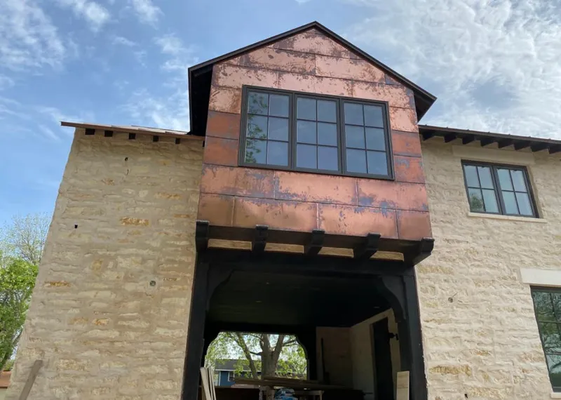 Copper metal panel facade on a stone building for Skylight Installation in Fair Lawn